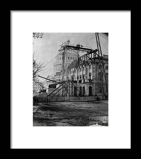 Working Framed Print featuring the photograph Building Of The United States Capitol by Bettmann