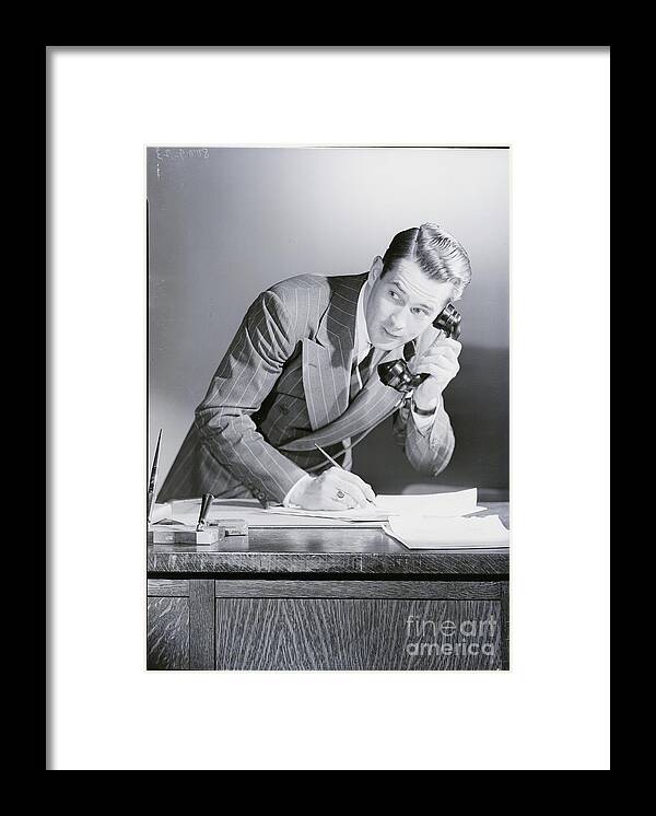 People Framed Print featuring the photograph Businessman Talking On The Telephone by Bettmann