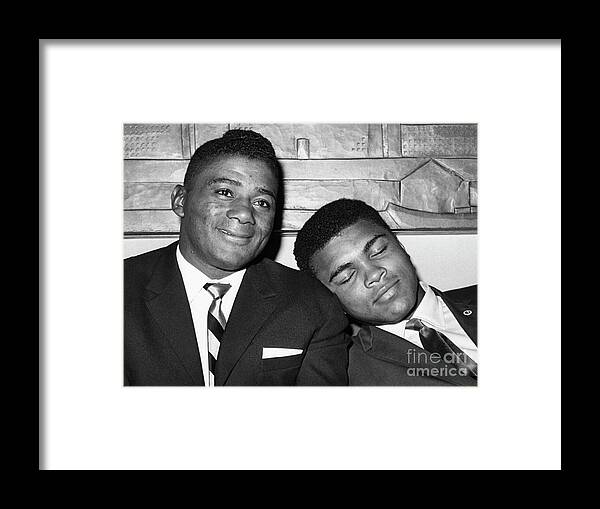 People Framed Print featuring the photograph Cassius Clay Napping On Floyd by Bettmann