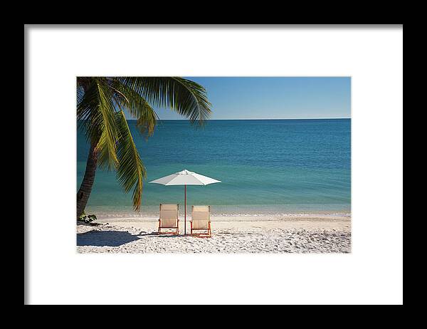 Tropical Tree Framed Print featuring the photograph Chair On Florida Keys Beach by Cdwheatley