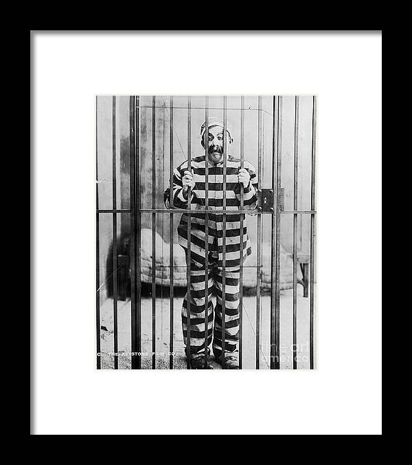 People Framed Print featuring the photograph Chester Conklin Behind Bars In Dodging by Bettmann
