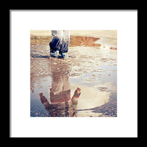 Toddler Framed Print featuring the photograph Child In A Puddle by Vpopovic
