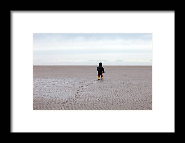 Hooded Shirt Framed Print featuring the photograph Child Walking Towards Sea On Beach by Koen Wolters Photography Huissen Nl