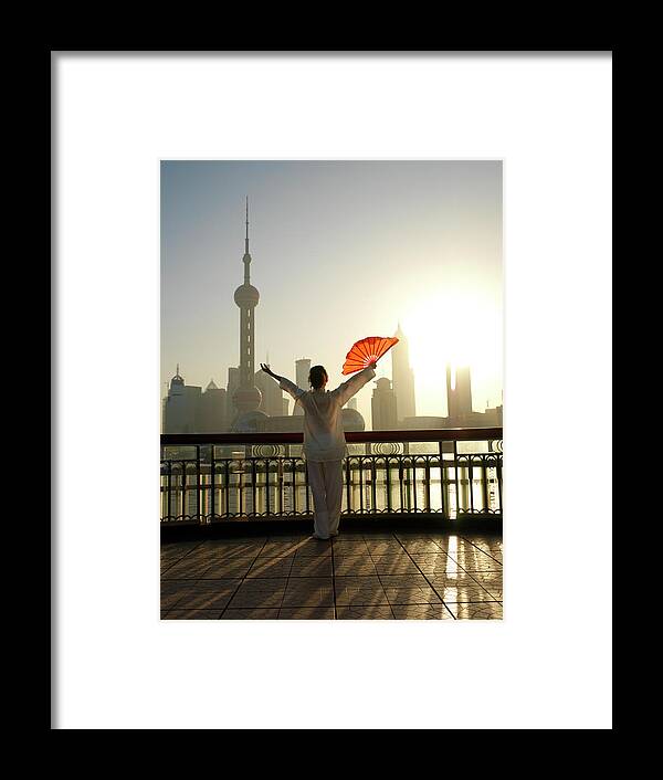 Chinese Culture Framed Print featuring the photograph Chinese Woman Fan Dancing In Front Of by Xpacifica