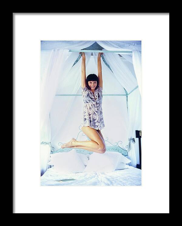 Beauty Framed Print featuring the photograph Christy Turlington Hanging From A Canopy Bed by Arthur Elgort