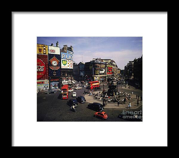 Piccadilly Circus Framed Print featuring the photograph Citizens And Traffic At Piccadilly by Bettmann