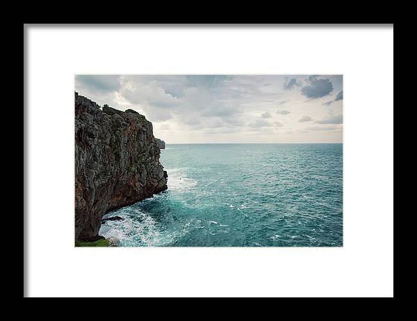 Tranquility Framed Print featuring the photograph Cliff Line And Stormy Mediterranean Sea by Guido Mieth