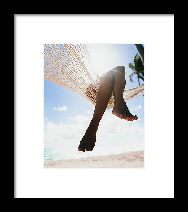 Hanging Framed Print featuring the photograph Close Up Of A Persons Crossed Legs by Digital Vision.