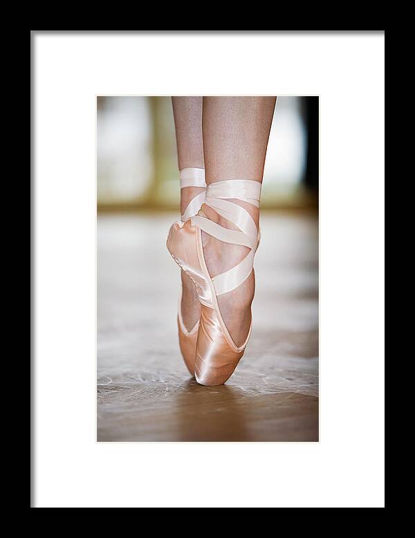 Ballet Dancer Framed Print featuring the photograph Close-up Of Ballet Dancer On Tiptoes by Beyond Foto