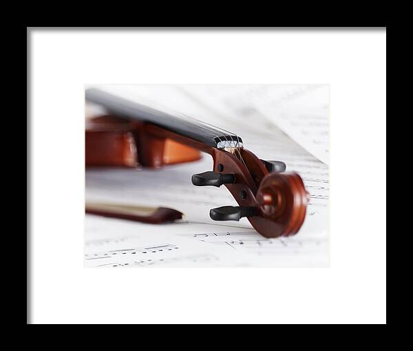 Sheet Music Framed Print featuring the photograph Close Up Of Violin, Bow And Sheet Music by Adam Gault