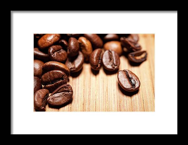 Bamboo Framed Print featuring the photograph Coffee Beans On Bamboo Mat by Gm Stock Films