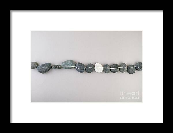 In A Row Framed Print featuring the photograph Collection Of Striped Rocks Arranged by Juj Winn