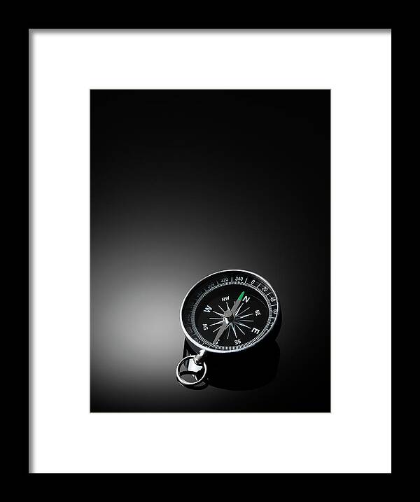 East Framed Print featuring the photograph Compass On A Dark Background by Wragg