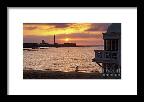 Nature Framed Print featuring the photograph Couple at Sunset in La Caleta Cadiz Spain by Pablo Avanzini