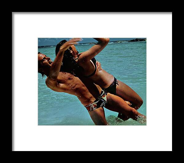 #new2022 Framed Print featuring the photograph Couple Playing In The Sea by Jacques Malignon
