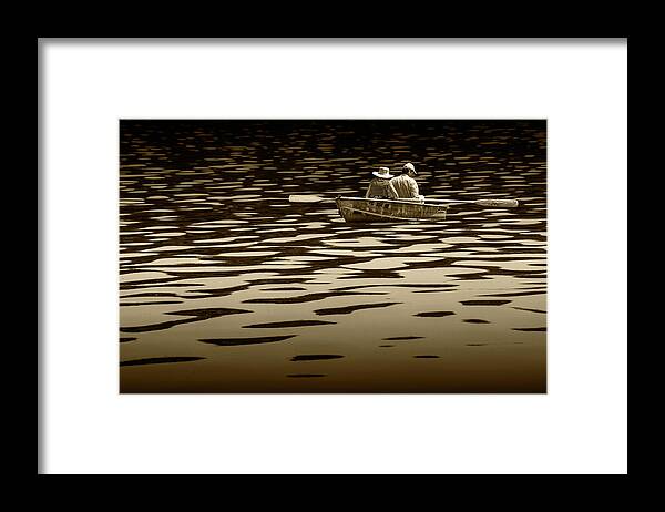 Oarsman Framed Print featuring the photograph Couple rowing on Stoney Lake at Sunrise in Sepia Tone by Randall Nyhof