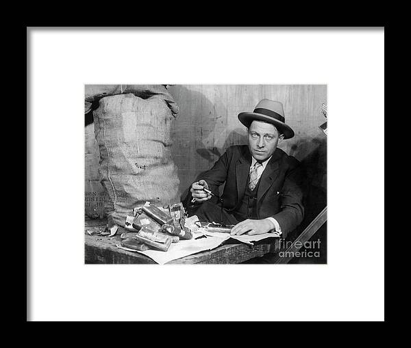 People Framed Print featuring the photograph Customs Officer Examining Confiscated by Bettmann