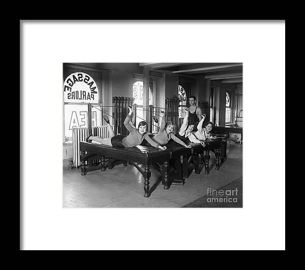 Child Framed Print featuring the photograph Dancers Exercising With Pulleys by Bettmann