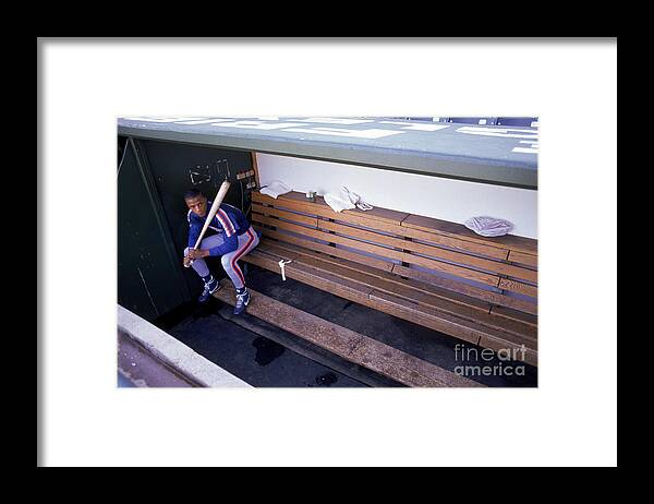 People Framed Print featuring the photograph Darryl Strawberry Sits In The Dugout by Jonathan Daniel