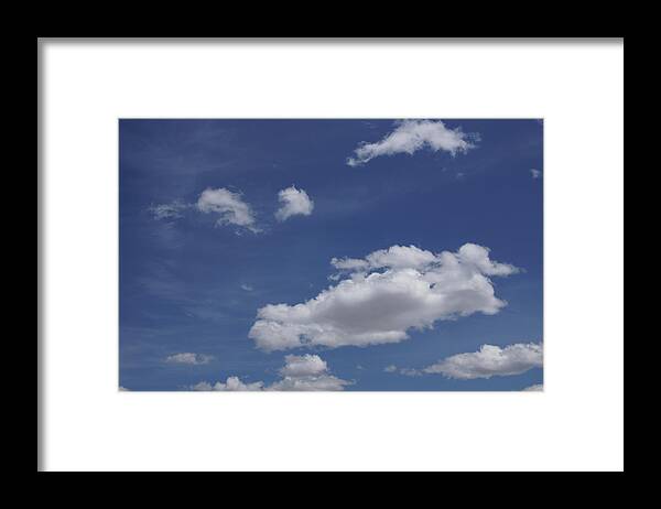 Deep Framed Print featuring the photograph Deep blue sky and fluffy cumulous cloud by Steve Estvanik