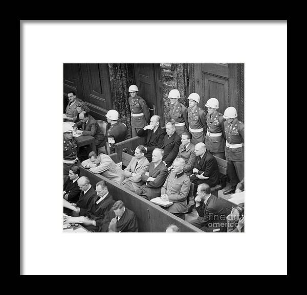 Nuremberg Trials Framed Print featuring the photograph Defendants At Nuremburg War Crimes Trial by Bettmann