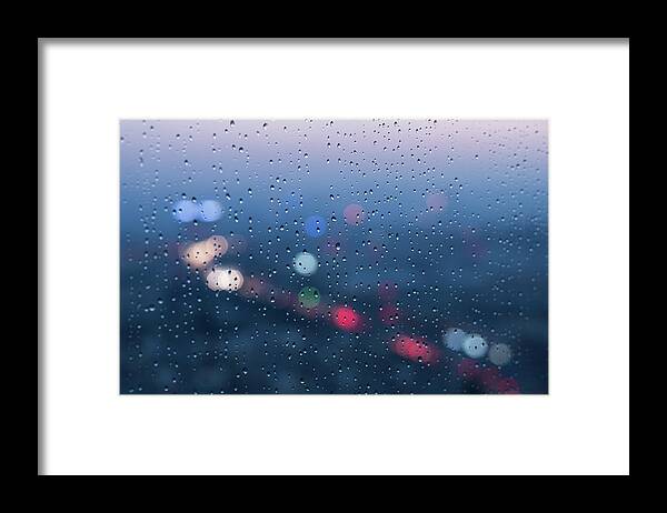 Tranquility Framed Print featuring the photograph Defocused Lights And Water Droplets On by Miragec