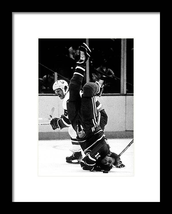 1980-1989 Framed Print featuring the photograph Denis Potvin Hits Guy Lafleur On The Ice by B Bennett