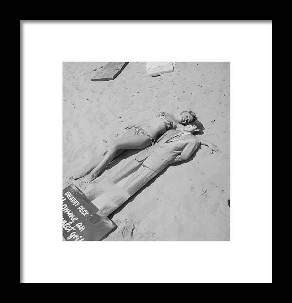 Swimwear Framed Print featuring the photograph Diana Dors Lying On The Beach At Cannes by Keystone-france