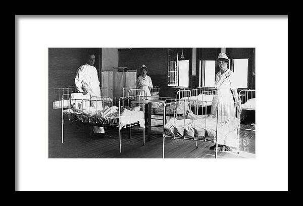 Toddler Framed Print featuring the photograph Doctor And Nurses With Infantile by Bettmann