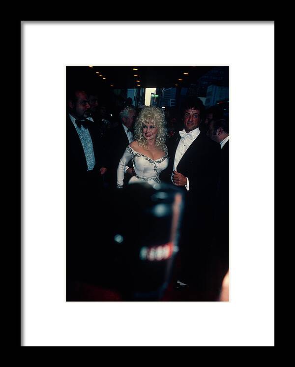Vertical Framed Print featuring the photograph Dolly Parton And Sylvester Stallone by Art Zelin