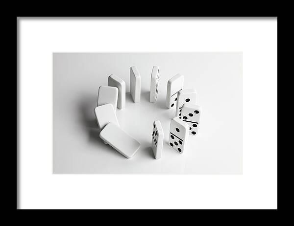 Problems Framed Print featuring the photograph Dominoes In A Circle Beginning To Fall by Larry Washburn
