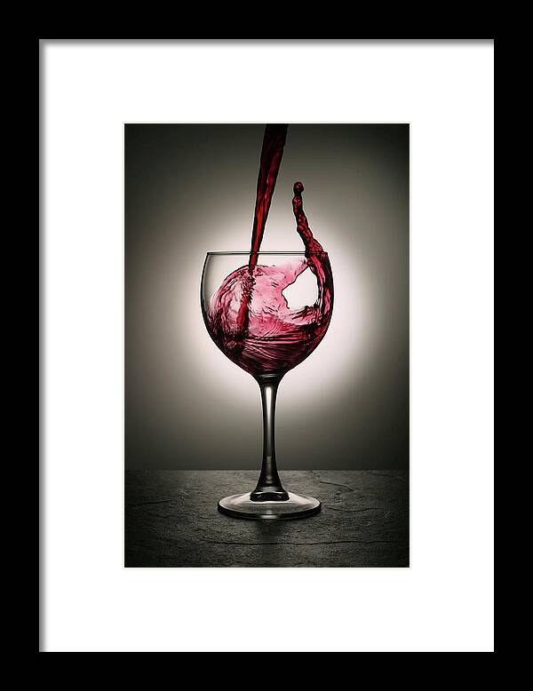 Alcohol Framed Print featuring the photograph Dramatic Red Wine Splash Into Wine Glass by Donald gruener