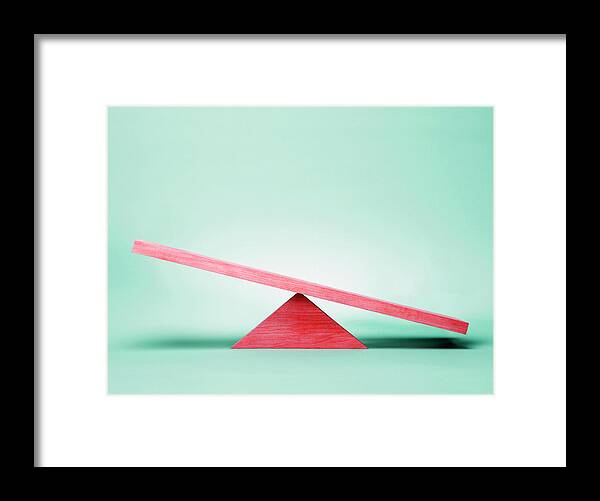 Empty Framed Print featuring the photograph Empty Red Seesaw On Green Background by Steven Puetzer