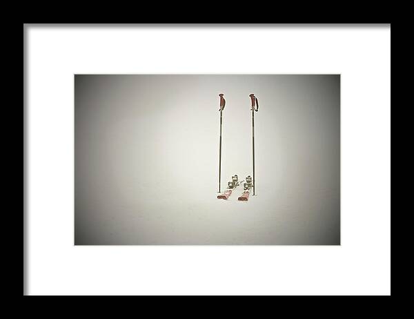 Ski Pole Framed Print featuring the photograph Empty Skis And Poles In Snow by Ross Woodhall