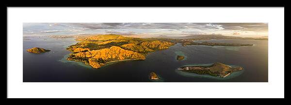Landscapeaerial Framed Print featuring the photograph Evening Light Illuminates Rinca Island by Ethan Daniels