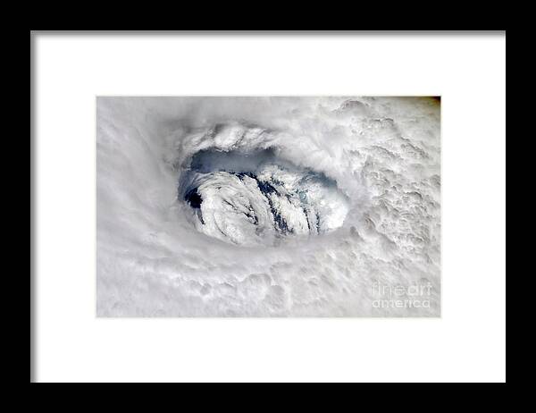 Cyclonic Storm Framed Print featuring the photograph Eye Of Hurricane Dorian From The International Space Station by Nasa/science Photo Library
