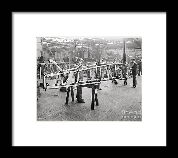 People Framed Print featuring the photograph Factory Workers Work On Aircraft Wing by Bettmann