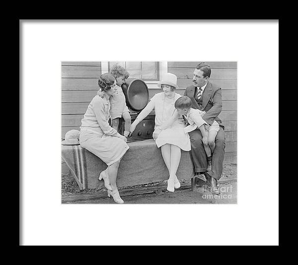 People Framed Print featuring the photograph Family Members Listening To Radio by Bettmann