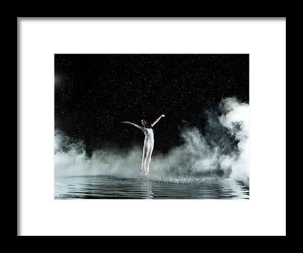 People Framed Print featuring the photograph Female In White Dancing, Rainy Night by Jonathan Knowles