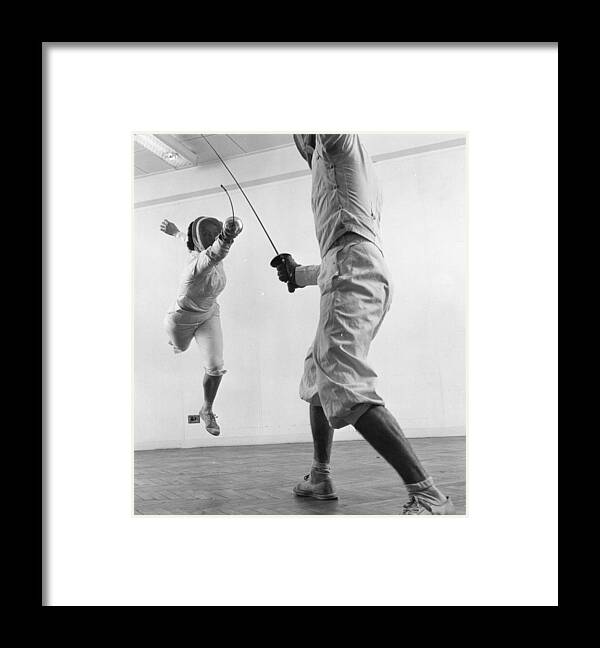 Foil Fencing Framed Print featuring the photograph Fencers by Thurston Hopkins