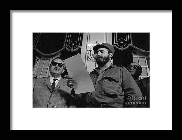 Mature Adult Framed Print featuring the photograph Fidel Castro Reading The Oath Of Office by Bettmann