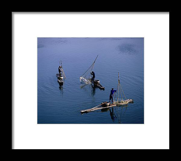 Fisherman Framed Print featuring the photograph Fishermen On Li River by Manfred Gottschalk