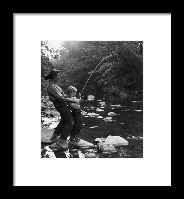 Pole Framed Print featuring the photograph Fishing For Fun by Hulton Archive