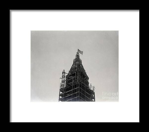 Founder Framed Print featuring the photograph Flag On Top Of Woolworth Bldg. Iron Fram by Bettmann