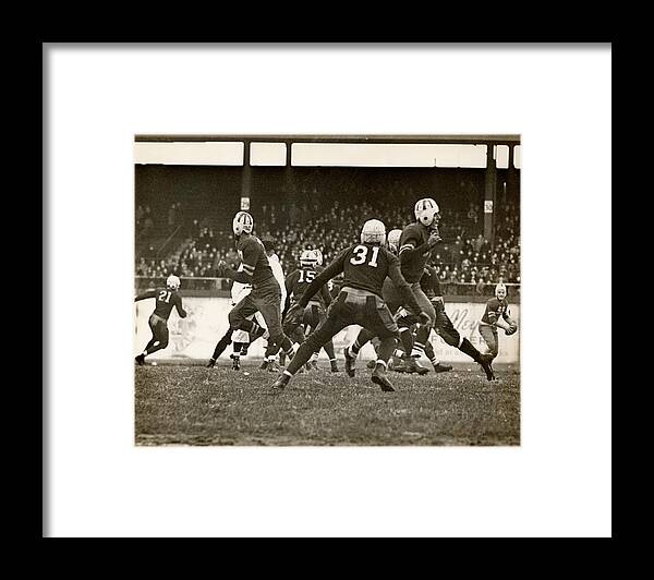 People Framed Print featuring the photograph Football Game In Progress by George Marks