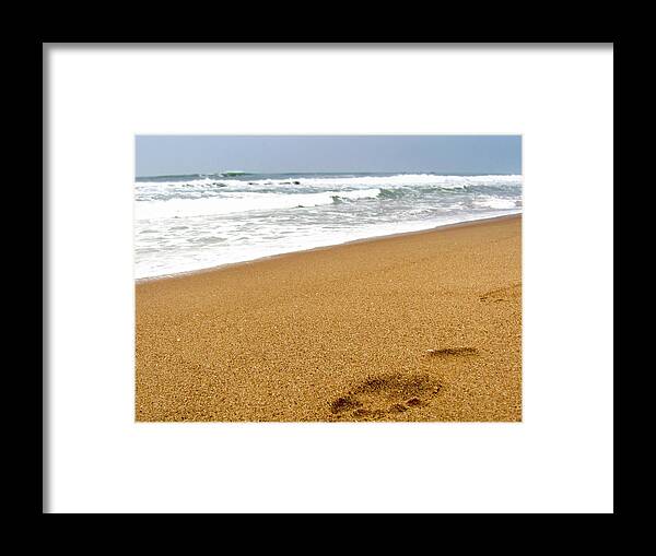 Tranquility Framed Print featuring the photograph Footprint On Sandy Beach With The Waves by Amlan Mathur