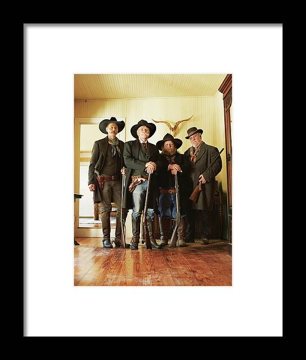 Rifle Framed Print featuring the photograph Four Cowboys With Rifles And Revolvers by David Sacks