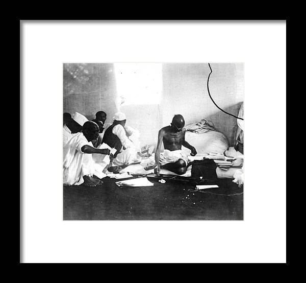 Releasing Framed Print featuring the photograph Gandhi Spinning by Keystone