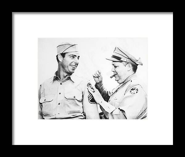 People Framed Print featuring the photograph General Sews On Dimaggios Patch by Bettmann