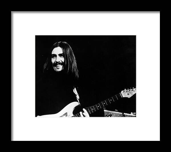George Harrison Framed Print featuring the photograph George On Stage by Keystone